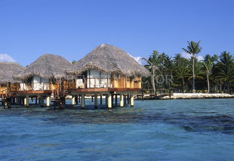 Islands;huts;ocean;palm trees;blue;water;sky;manihi;french polynesia
